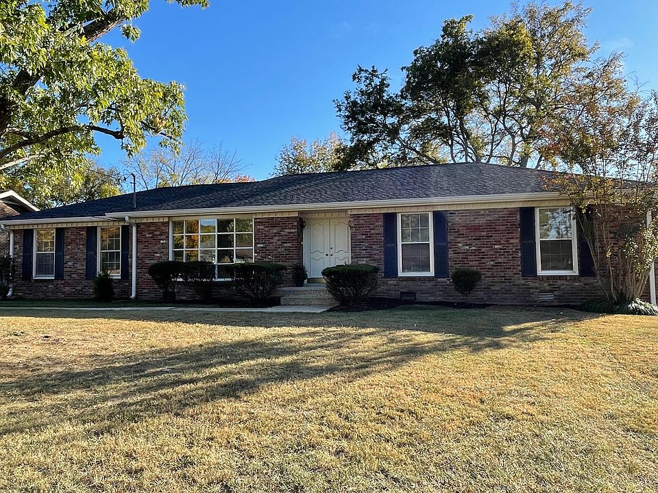 Front exterior of home. Level yard with trees in nice neighborhood. New gutters, exterior trim cleaning and painting