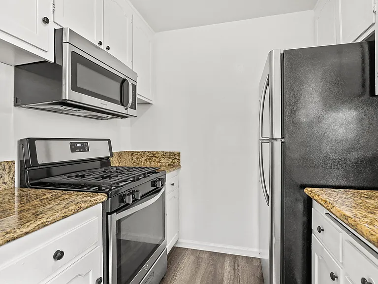 Kitchen with Stainless-Steel Refrigerator, Stove, and Microwave Oven