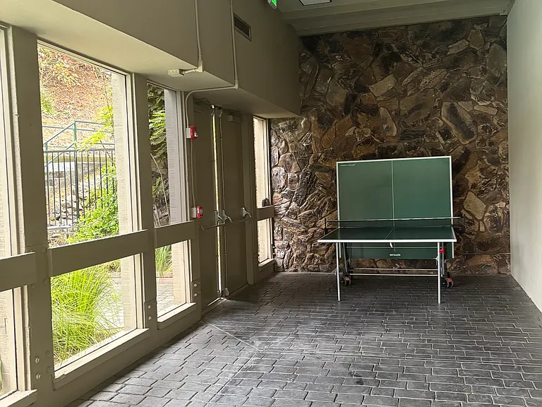 A ping pong table located on the lower level of the clubhouse is a great way to have fun.