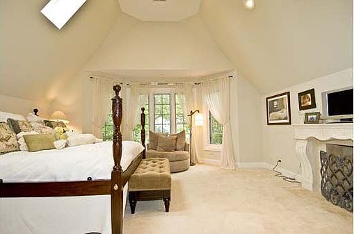 Master BR w/limestone fireplace, skylights.