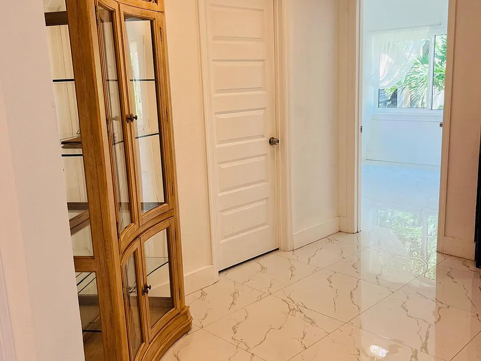 A way to the bathroom with washer/dryer & full kitchen