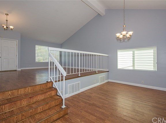 Double door entry, large living and steps down Dining room