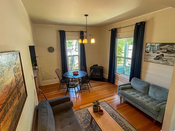 Living room and front entry with cozy gas fireplace