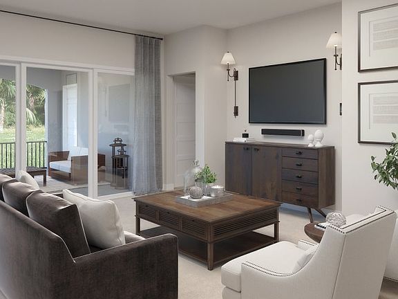Tucked between the patio and dining room, the living room provides peaceful, natural light to relax
