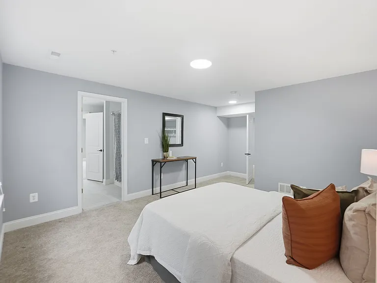 Fifth bedroom in basement with full en-suite and large walk-in closet, perfect for an in-law suite or long term guests.