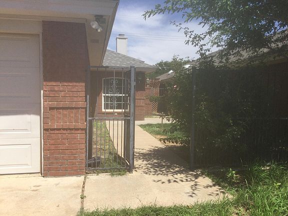 Two car garage with opener and front entryway