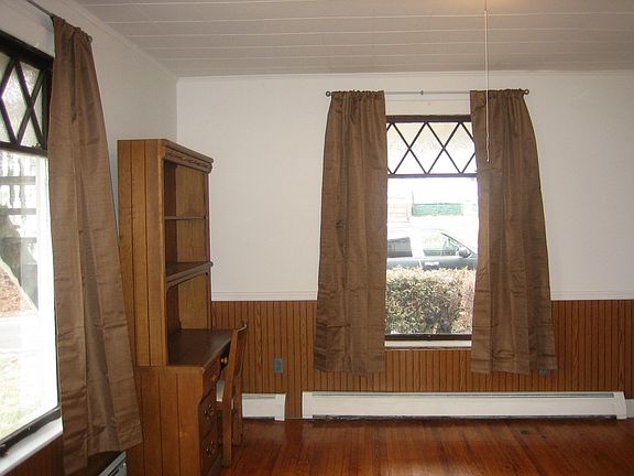 1st bedroom divided from living room by pocket doors.