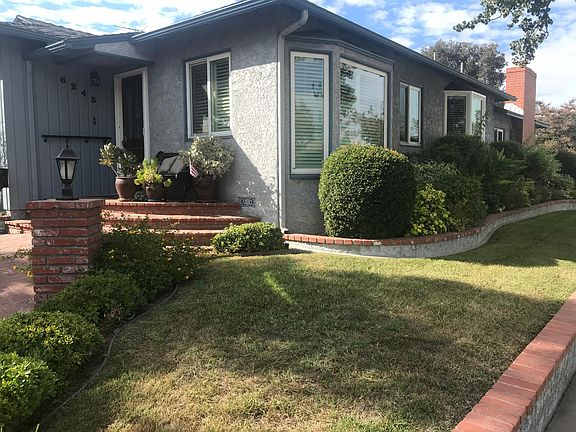 Nice brick entry with new front door and phantome screen