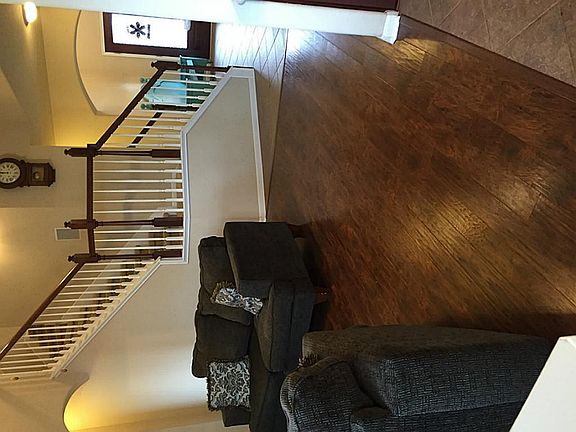 Gorgeous wide planked, scraped wood floors throughout living and master.