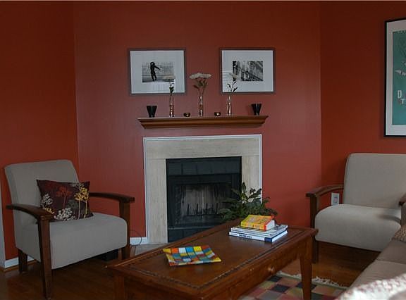 living room with wood burning fireplace