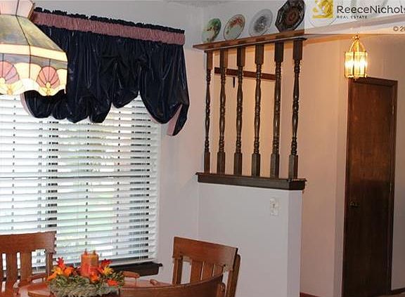 Dining Room surrounded by plate rack. Window looks out to courtyard