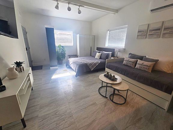 Enjoy a spacious closet, stylish nightstand, decorative lamp & charming artwork. Lakeland, FL