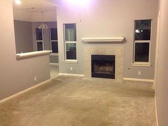 Living room now has hardwood/pergo. Fireplace. Very open pla