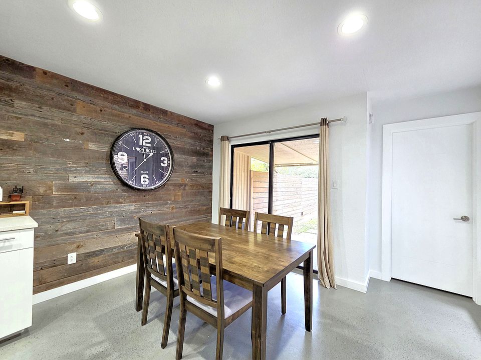 Dining area with wood accent wall