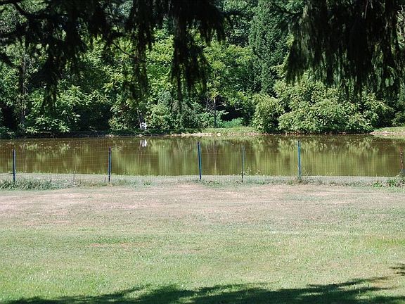 view of pond from rear private porch