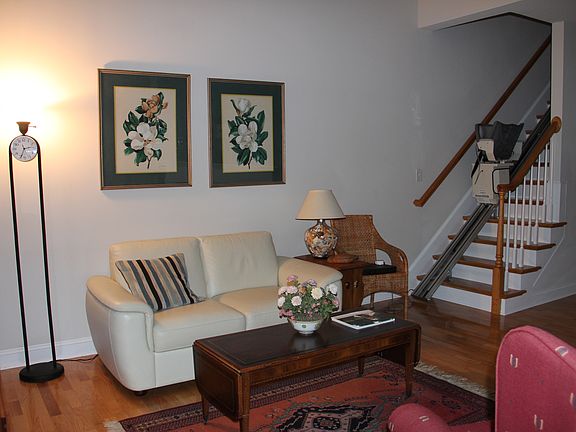 Living room with chair lift to 2nd floor