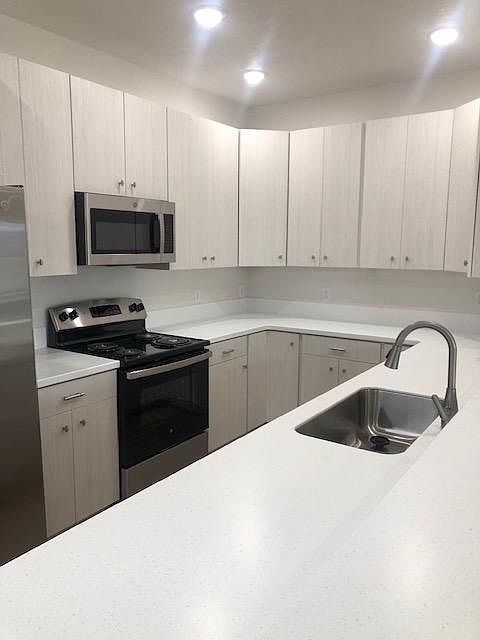Generously sized kitchen with stainless steel appliances