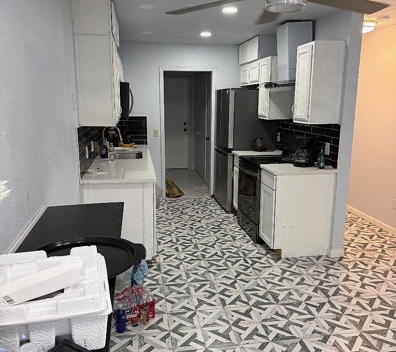 Kitchen and dining area also leading to the laundry room and then out to the garage