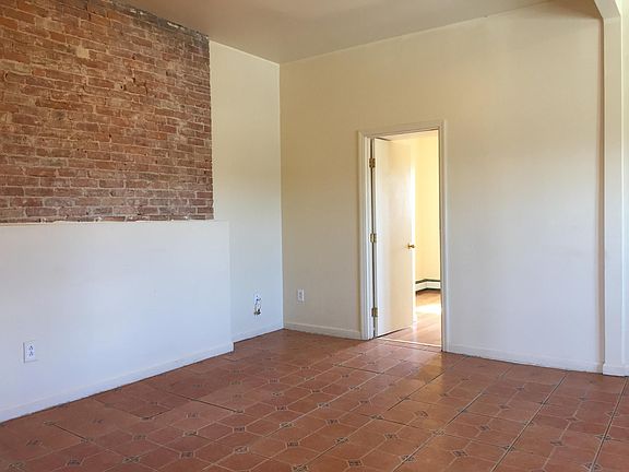 living Room with exposed brick wall