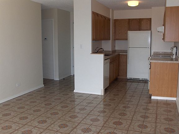 From livingroom towards kitchen & entry
