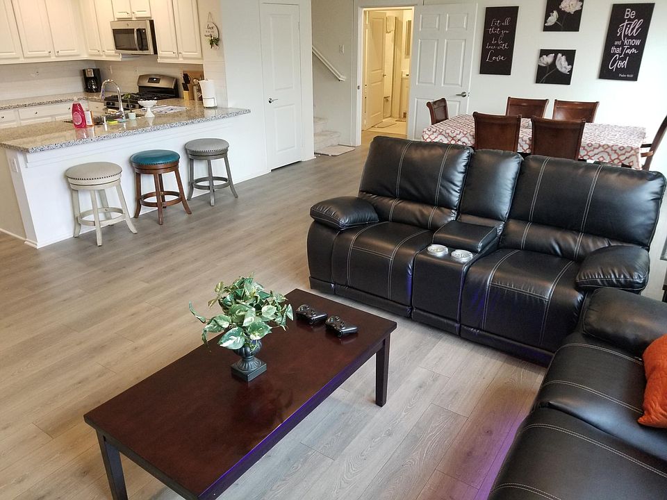 Great room on ground floor. The door beside the dining table will be locked if the downstairs' unit of one bedroom/one bath is rented out to another group.