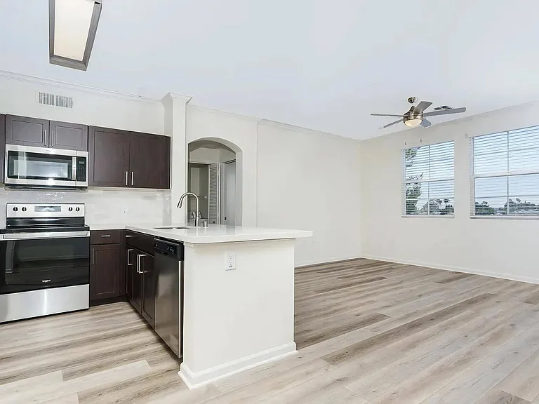 Open Floor Plan with Kitchen Island Overlooking Living Area
