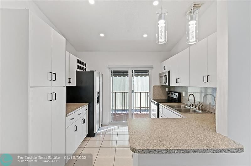 1st image of 7825 W 36th Ave Unit 203