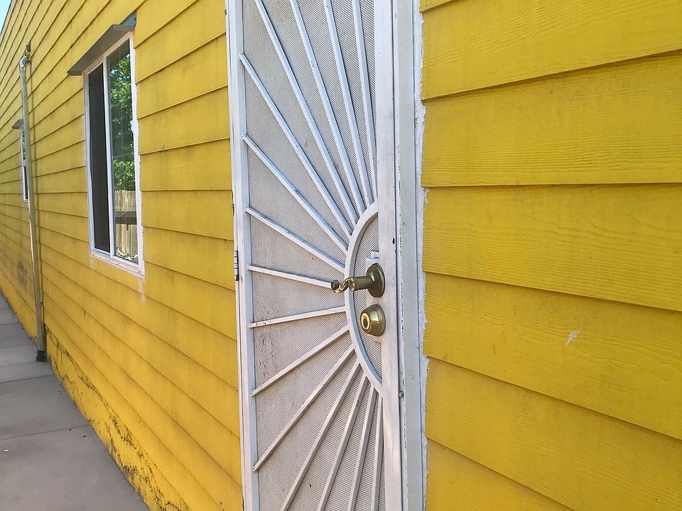 The main entrance faces a quiet neighbor's backyard.