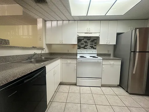 5011 Wiles Rd Photo 1