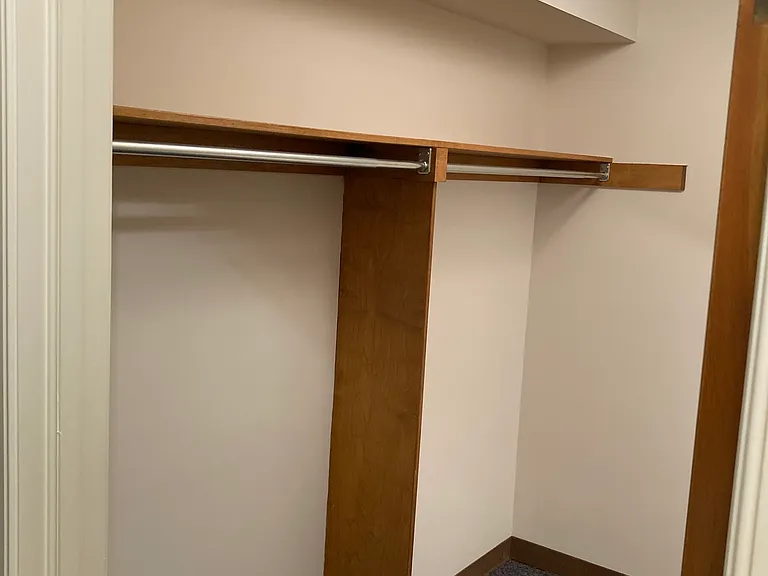 Walk-in Closet by entry from Garage