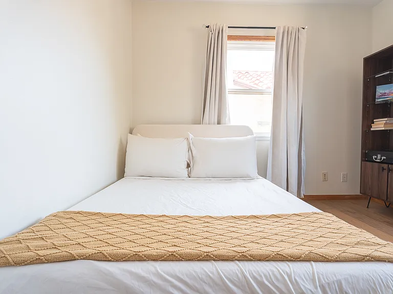 Full size bed in downstairs bedroom