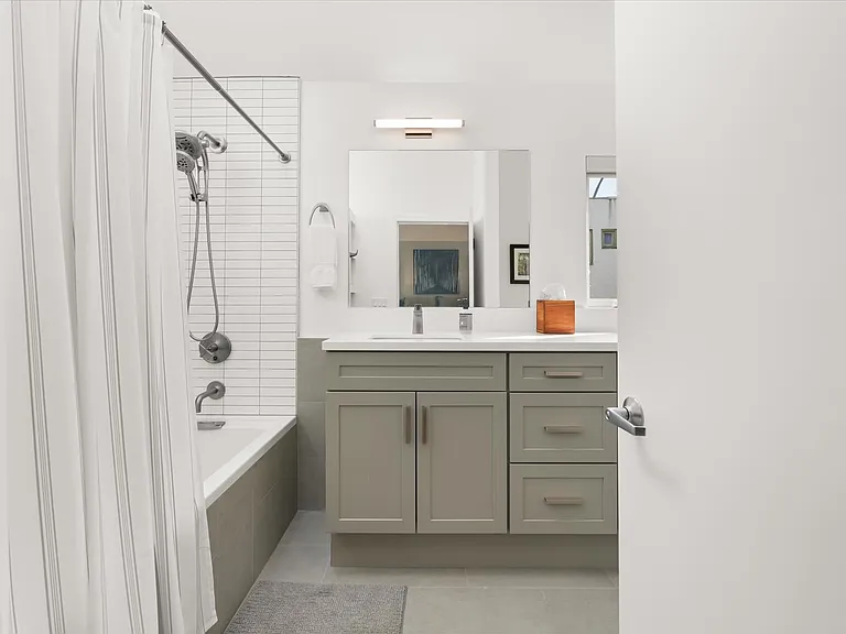 New bathroom with modern vanity and updated finishes.