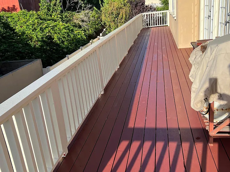 Deck runs full width of house