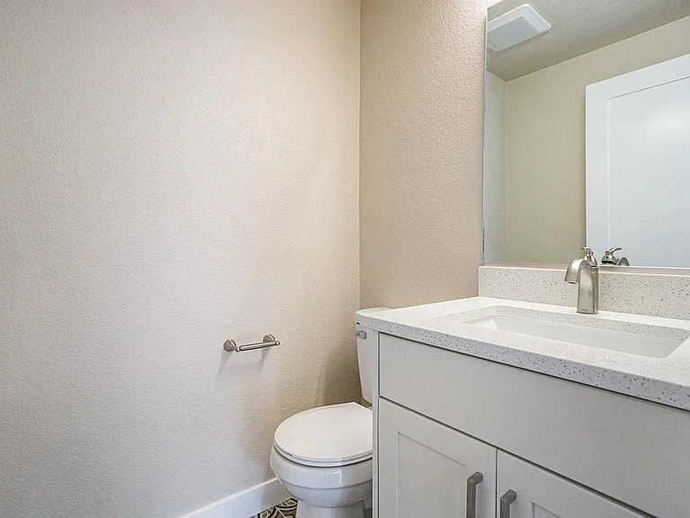 1/2 bath on main floor with new fixtures, cabinets and counter top