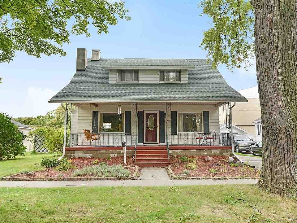 Beautiful home with a charming front porch on Raymond