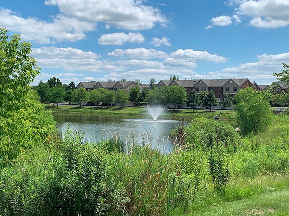 Pond with water fountain adjacent to Shelburne Crossing