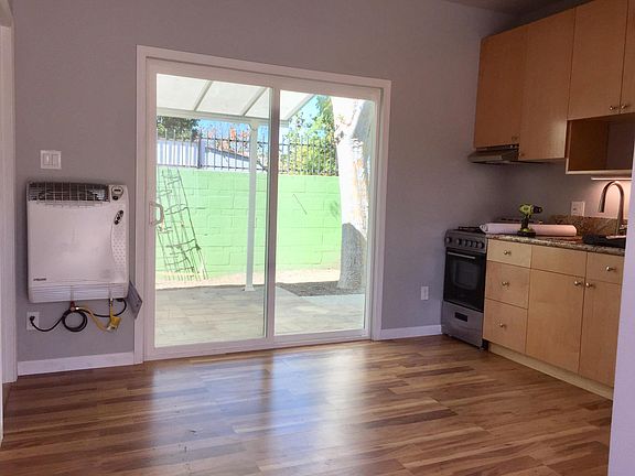 View from front door, kitchen and bathroom to right, bedroom