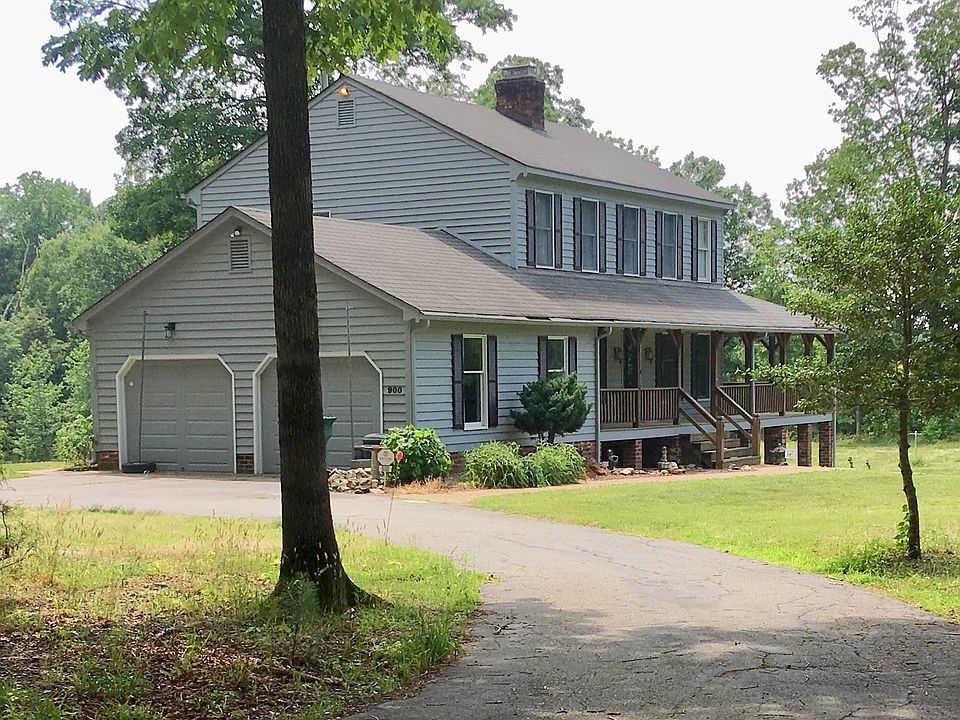 Automatic garage doors, circular drive, overflow parking.