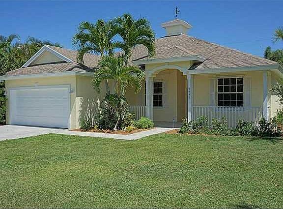 Exterior Front. 9446 SE Mercury St 3Bed 2Bath 2Car Gar + Office & Screened Pool