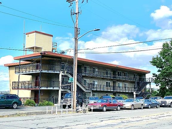 Front of building with parking.