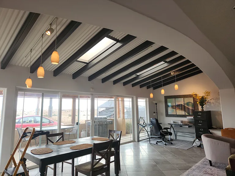 The dining area and work corner from under the spiral staircase.