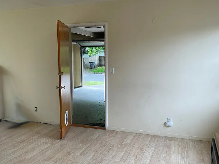 Dining Room Area, taken from Kitchen Area and Looking Out Into Garage