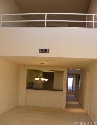 Large loft overlooks living room and views