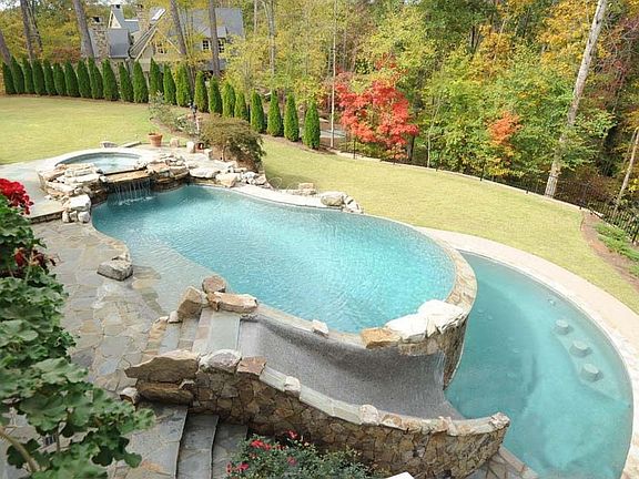 WOW! Tri-level Pebbletech Pool.