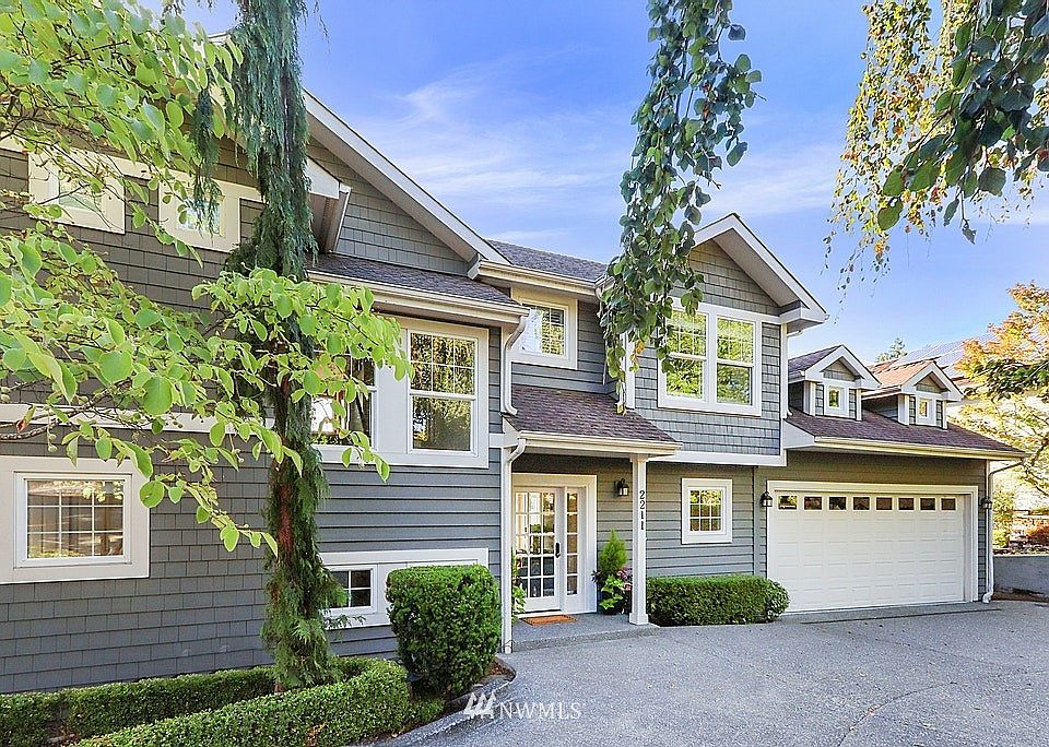 Beautiful, traditional, remodeled/reconstructed home located on a private lot on one of the best streets on Mercer Island.