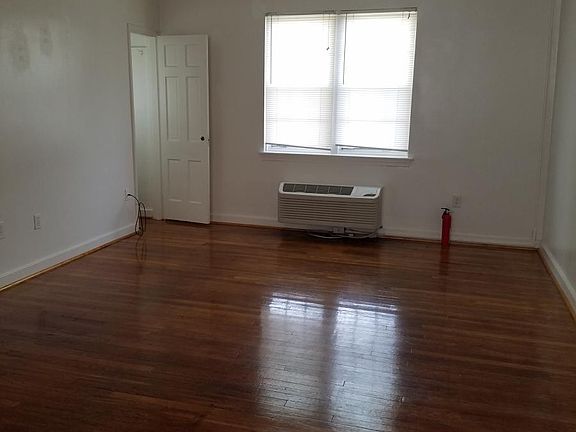 Large living room with hardwood floors, new heating/ac unit