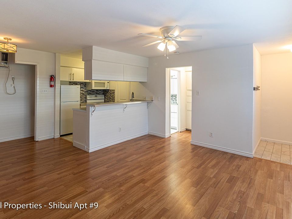 View of living living area, kitchen, and entrance