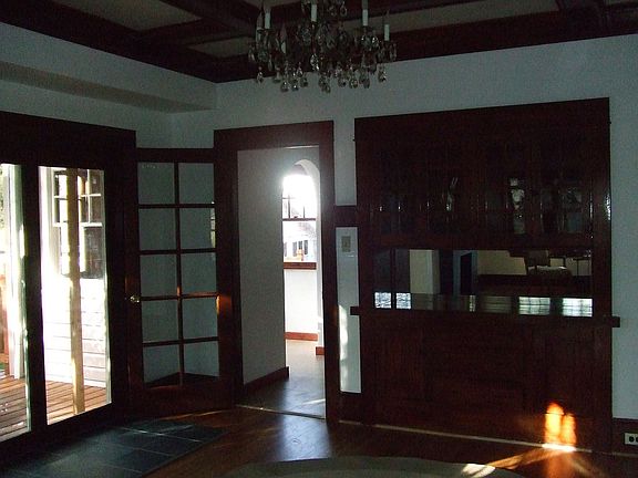 Ten pane glass doors lead from DR to kitchen, note the built in buffet.