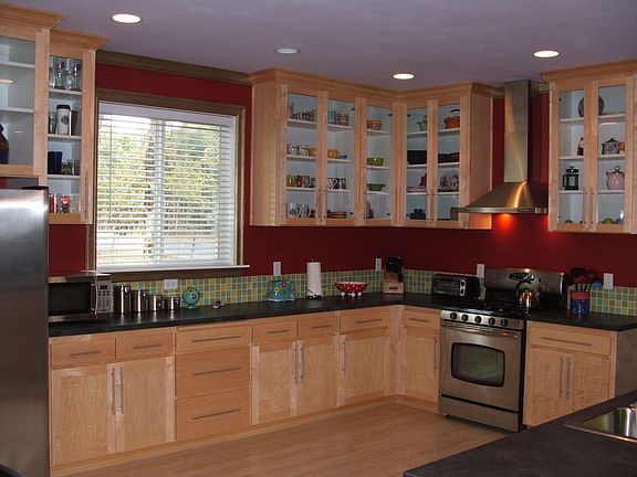 Maple cabinets with glass and custom handles 