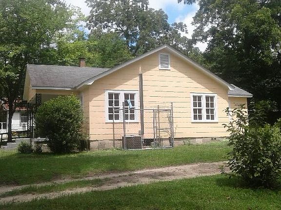 Side of house showing new central air unit